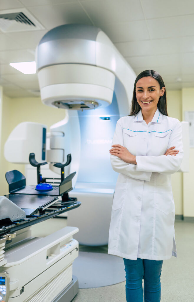 Cancer treatment in a modern medical private clinic or hospital with a linear accelerator. Professional doctors team working while the patient is undergoing radiation therapy for cancer